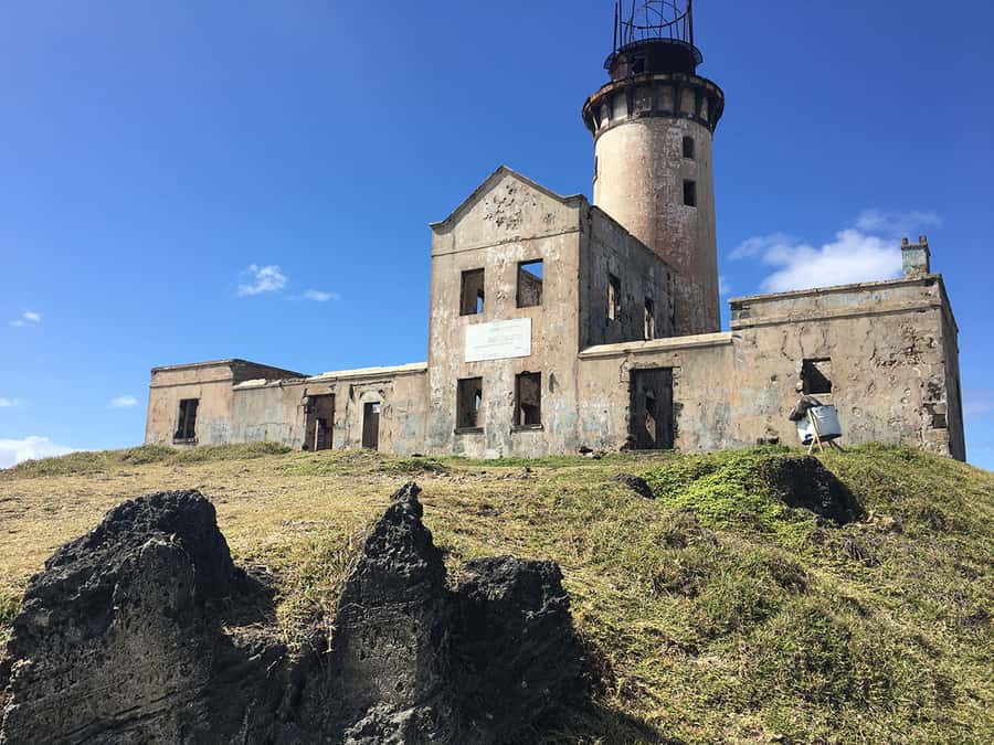 From Blue Bay: Ile aux Cerfs Speedboat Excursion with BBQ - The old lighthouse at Ile aux Fouquets