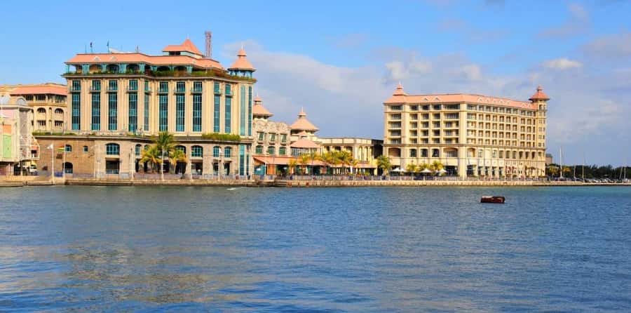 Mauritius: North Tour with Tea Tasting & Oceanarium Visit - Caudan Waterfront shifts the mood from market to leisure